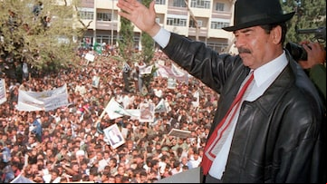 FP130 This photo released by the Iraqi News Agency 02 April shows Iraqi President Saddam Hussein waving to ers during his visit to the town of Kirkuk north of Baghdad. UN weapons experts, accompanied by diplomats, have entered all eight presidential sites and should complete their initial inspections within the next few days, said a UN official 02 April. AFP PHOTO INA